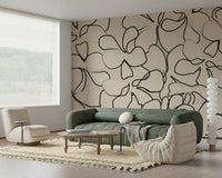 Interlocking organic outlines in black across a warm-toned wall mural., GD5479