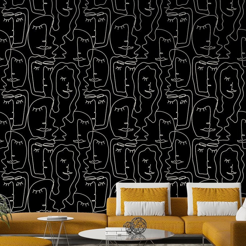 A modern studio decorated with a faces wallpaper

