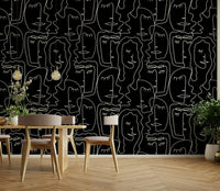 A contemporary bedroom with an abstract faces mural

