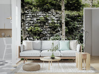 Abandoned ruins wall mural with lush foliage in a minimalist apartment.