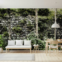 Overgrown Serenity wallpaper used as a textured feature wall in a lounge.