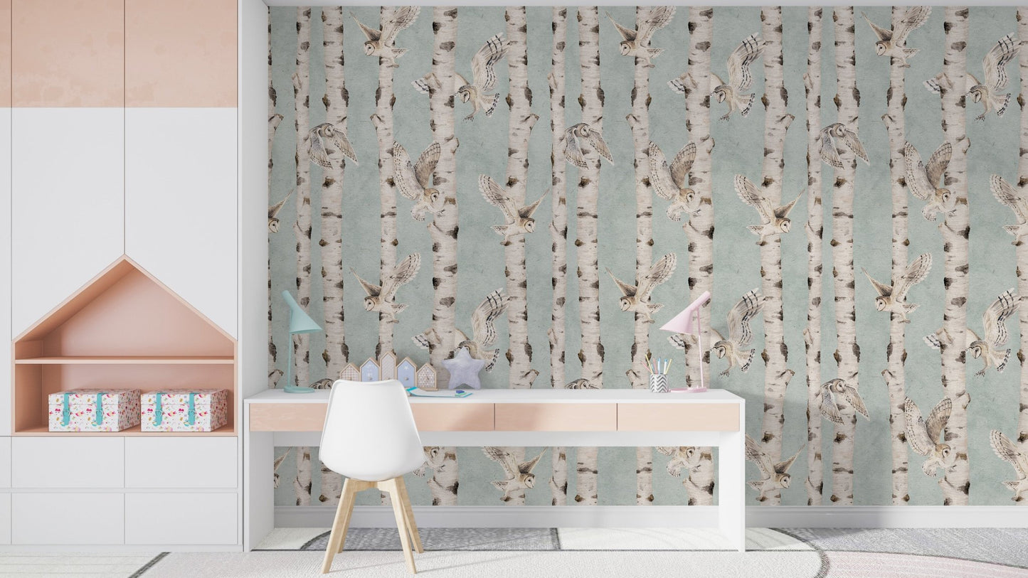 Elegant owls among birch tree trunks

