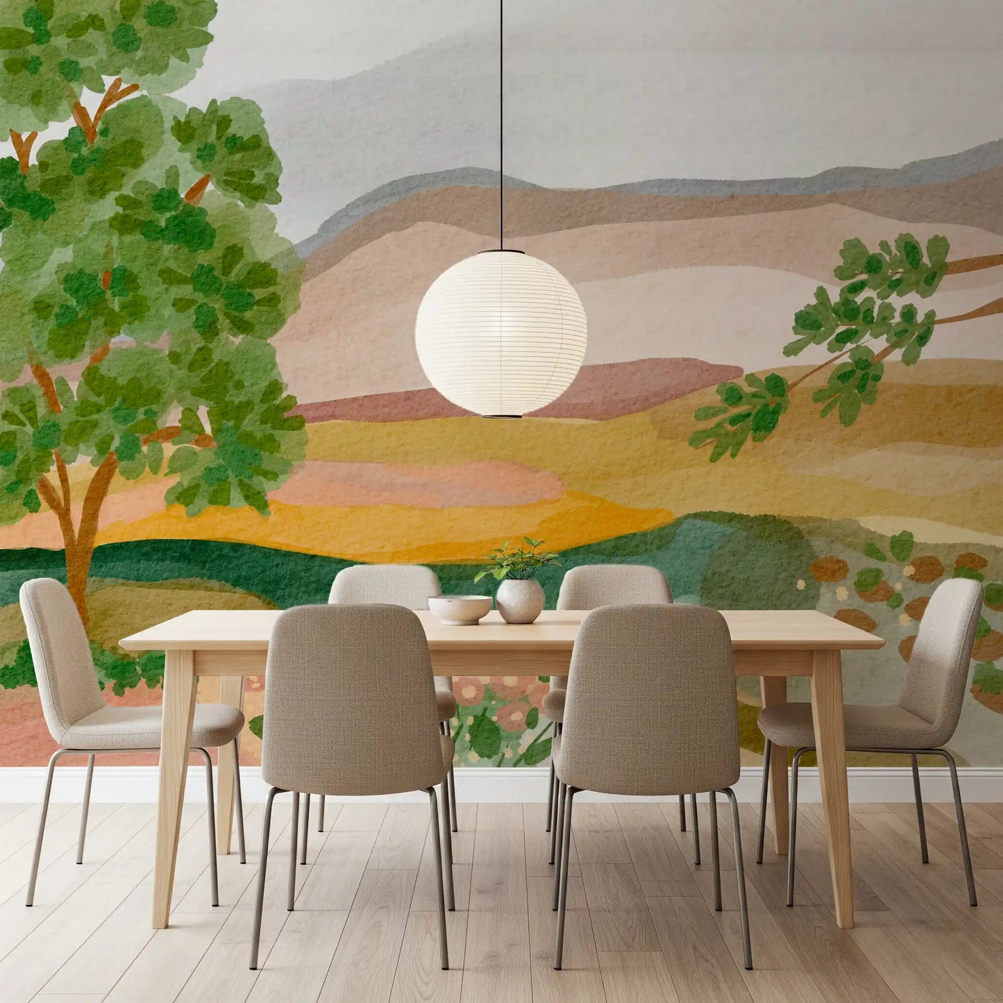 A dining room features the tranquil Painted Hillside Calm Wall Mural as a backdrop.