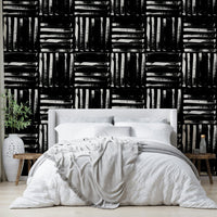 The painted stripes wallpaper installed in a living room, creating a clean backdrop