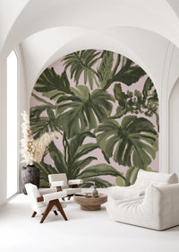 Tropical leaf wall mural with expressive green brushwork on pale blush