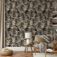 A bedroom decorated with a palm leaf mural

