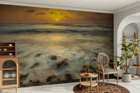 Beach sunset mural with warm sky and sea

