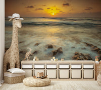 Smooth shoreline mural wallpaper with glowing sun

