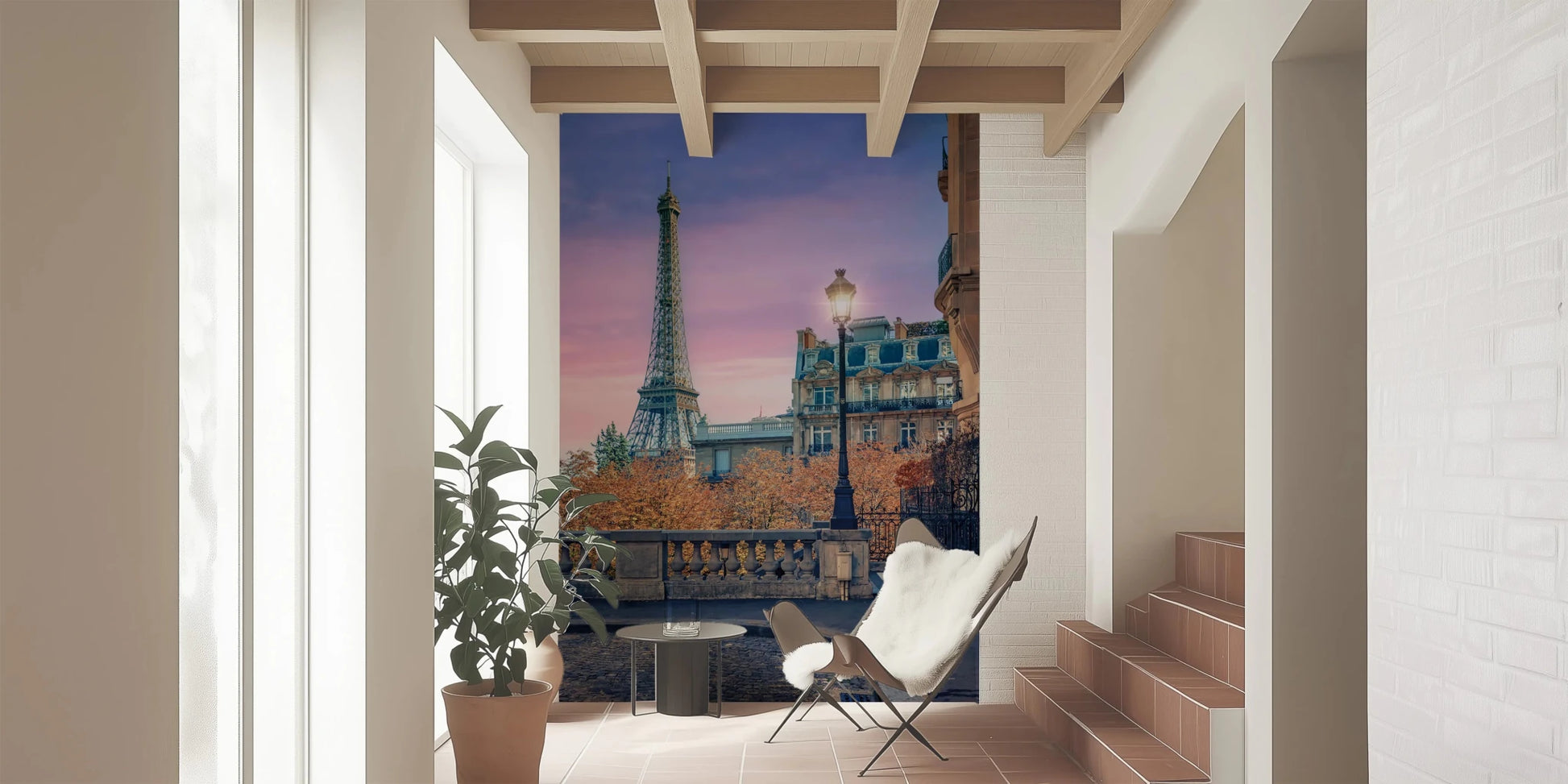 Sunset cityscape wall mural with a cobblestone street and iron railings.