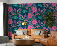 Parrot Bloom wallpaper in a modern living room with tropical plants.