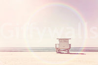 Serene beach mural in pastel colors for a calming vibe.

