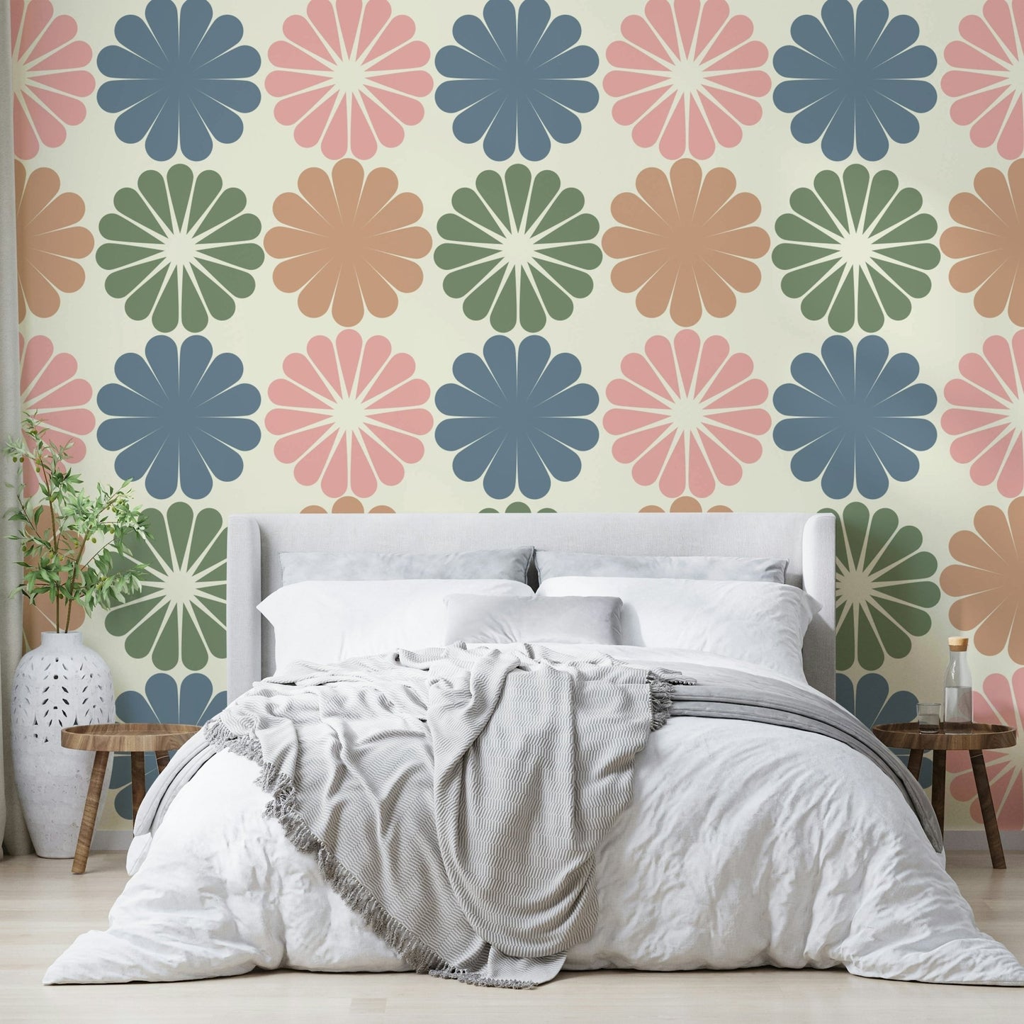 A close-up of a pastel geometric flower pattern on wallpaper.

