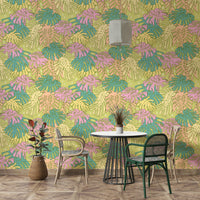 Trendy tropical monstera wallpaper with avocado background

