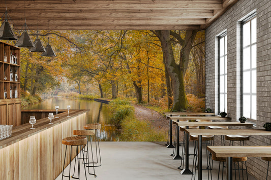 A peaceful wall mural of a canal in a forest.

