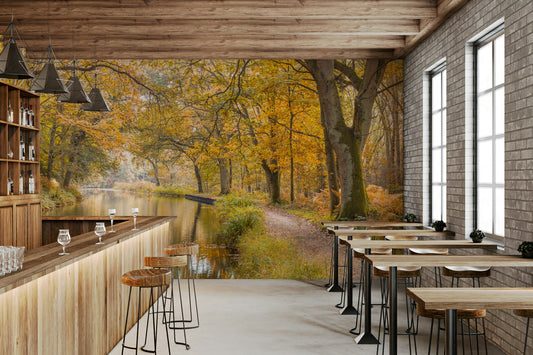 A peaceful wall mural of a canal in a forest.

