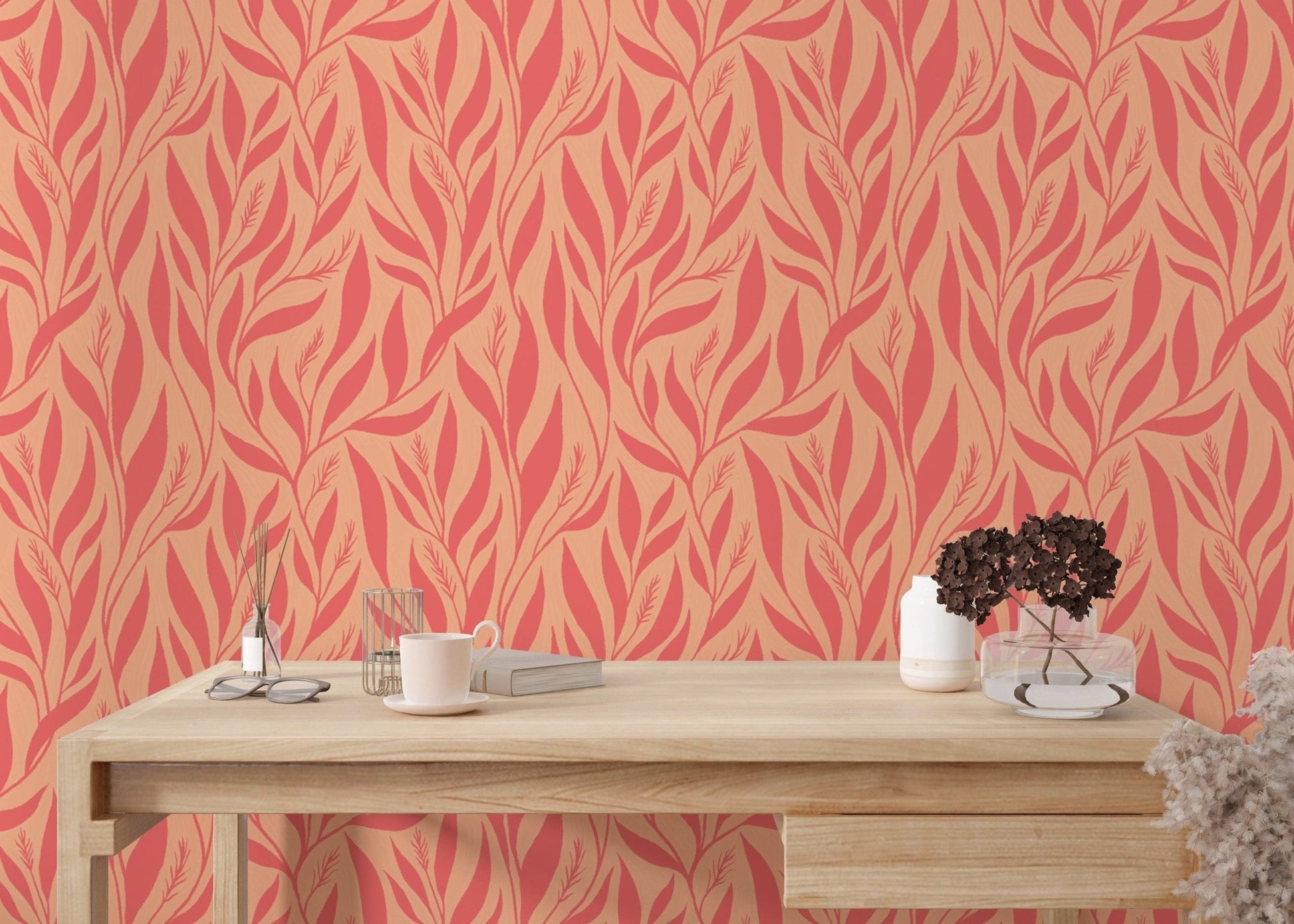 Peach pink wallpaper with leaf patterns
