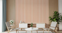 Living room area with Peach & Cream Stripes Wallpaper and a bright striped 