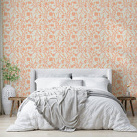 Wallpaper with soft peach blossoms and leafy accents


