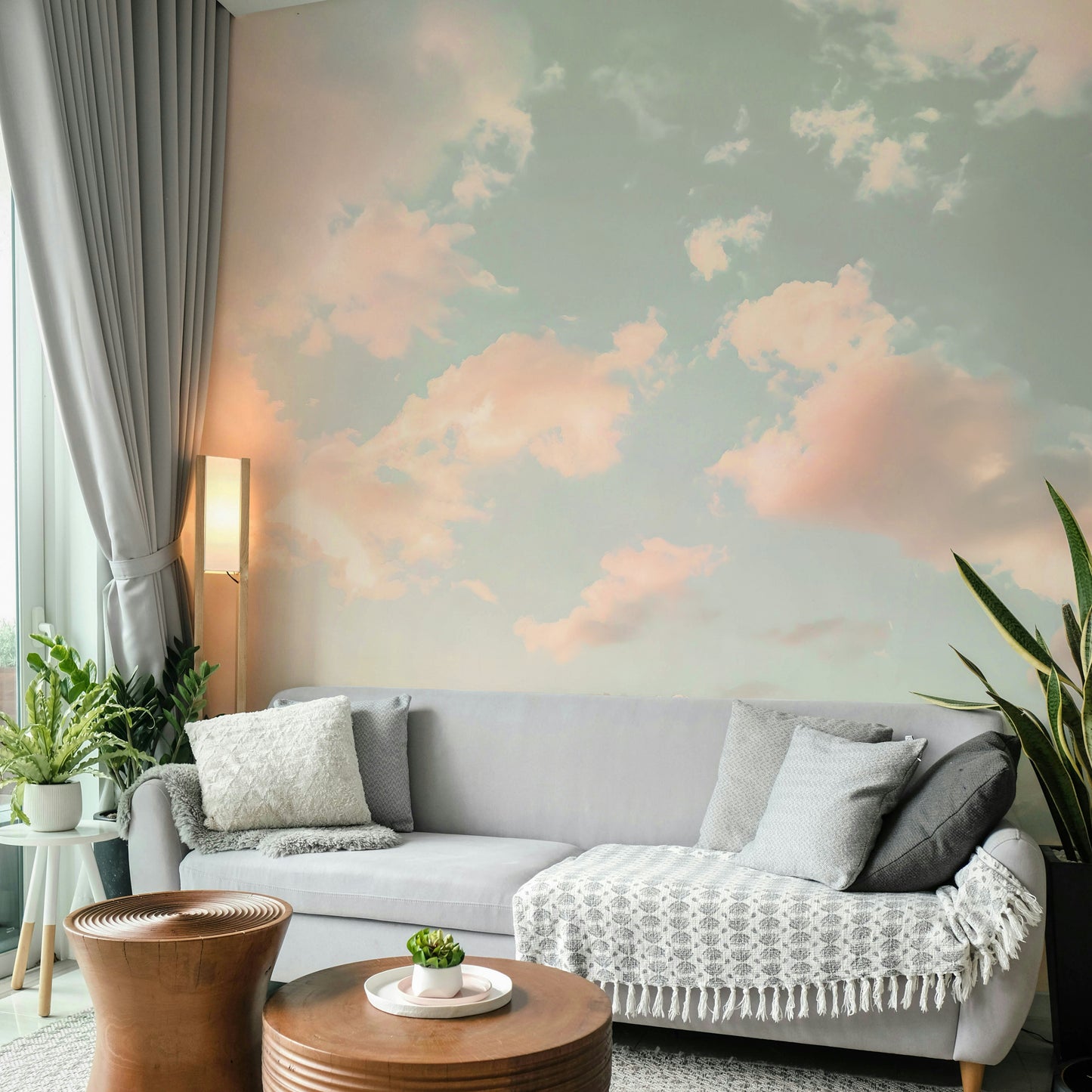 The design features a cloudy sky with soft, cloud formations.

