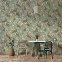 Walter Crane peacock garden in green and mustard wallpaper design.

