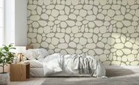 Artistic Pebble Beach wall mural flowing pattern subtle colors.