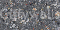 Wall mural showcasing mixed stone fragments on a dark surface.