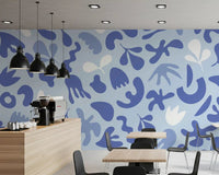 Cafe area styled in Cut Flow wall mural with airy abstract forms