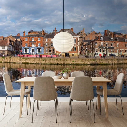 Dining room with Picturesque Riverfront Wall Mural and a calm riverside town view