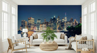 Nighttime panoramic wall mural of a glowing downtown business district.