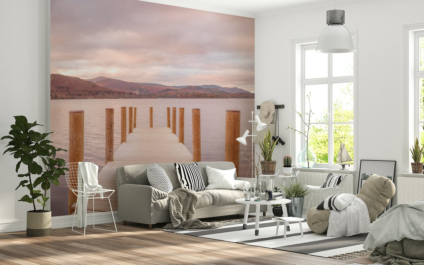 Lush forest landscape wallpaper behind a wooden bed frame in a master bedroom.