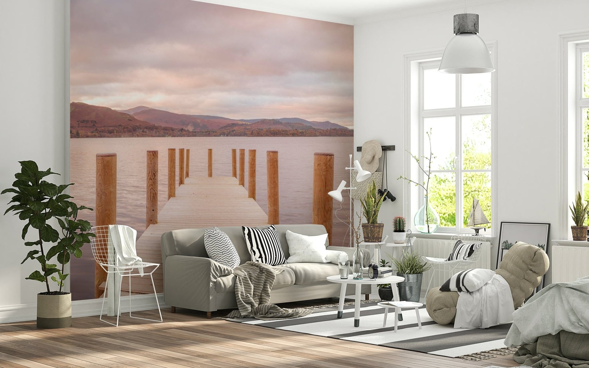 Lush forest landscape wallpaper behind a wooden bed frame in a master bedroom.