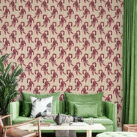 Close-up of tiger motifs on pink wallpaper

