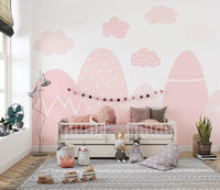Pink mountain kids wallpaper with white accents and clouds.