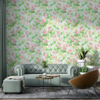 Floral watercolor wallpaper with soft pink rose motifs.

