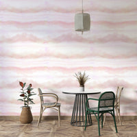 The image features a sky with soft, blending shades of pink and other light colors.
