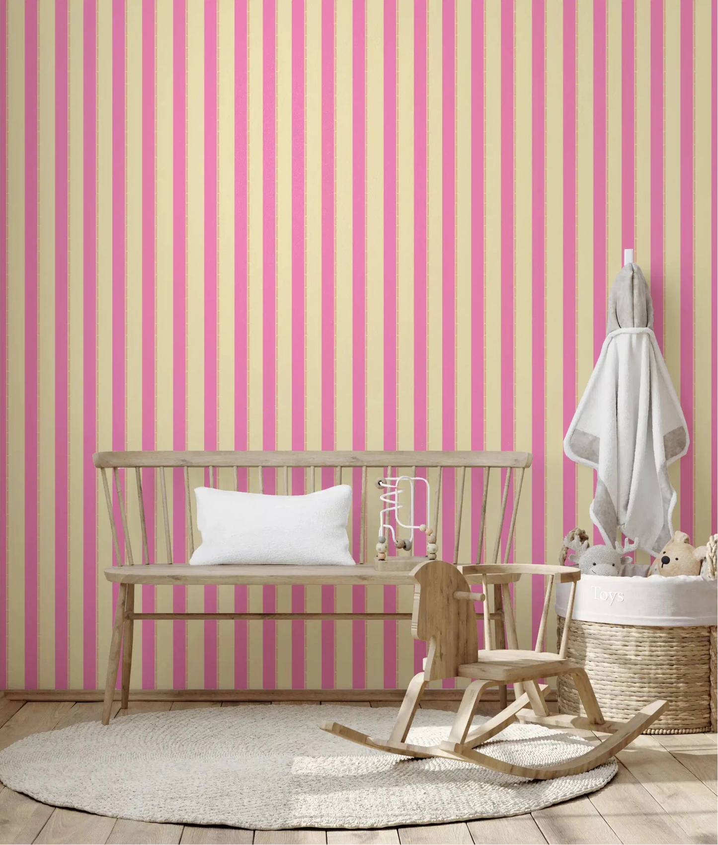 Pink Stripe Delight Wallpaper behind a crib in a soft nursery with wooden toys, GD8902