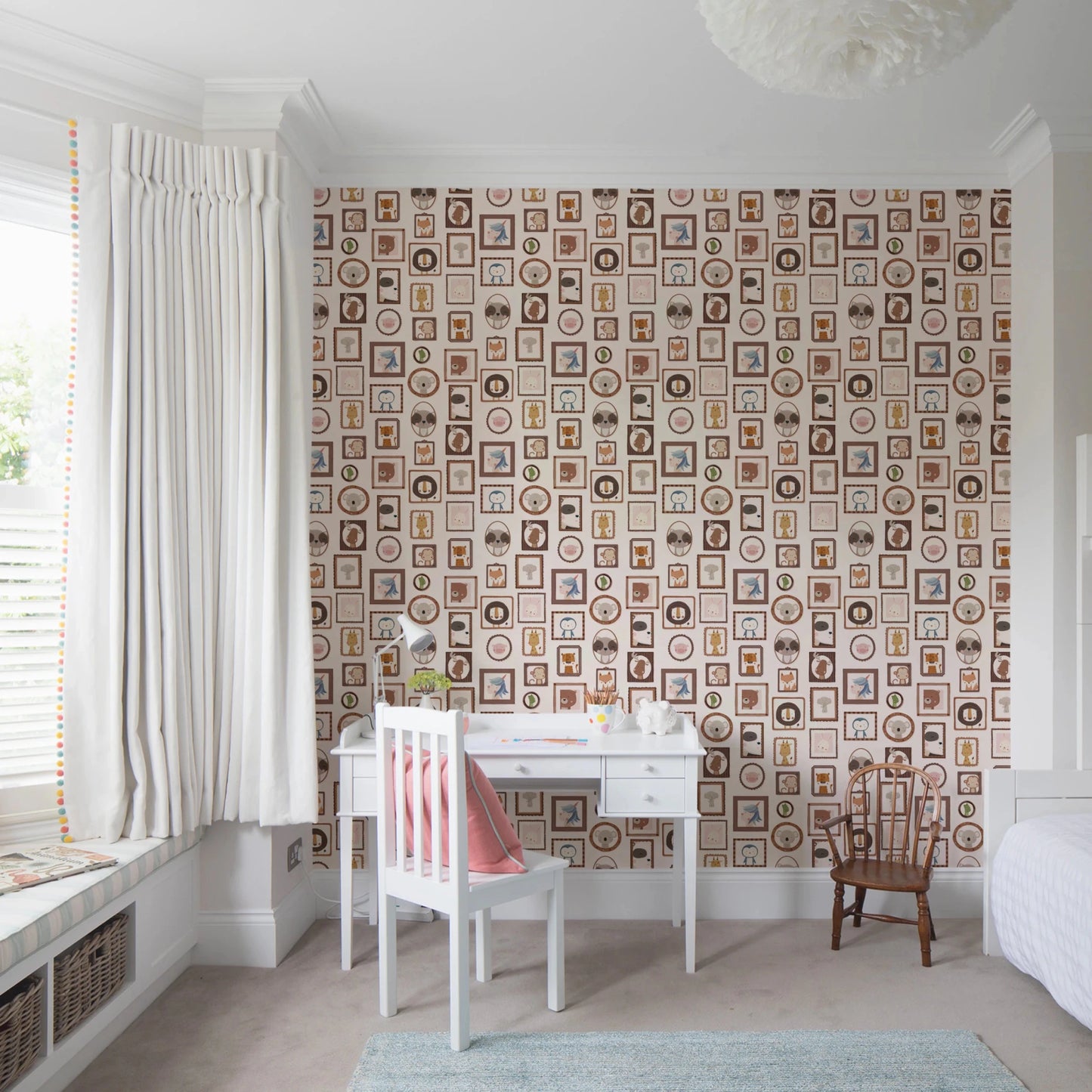 Window-lit workspace framed by Playful Animal Portraits Wallpaper and light furniture