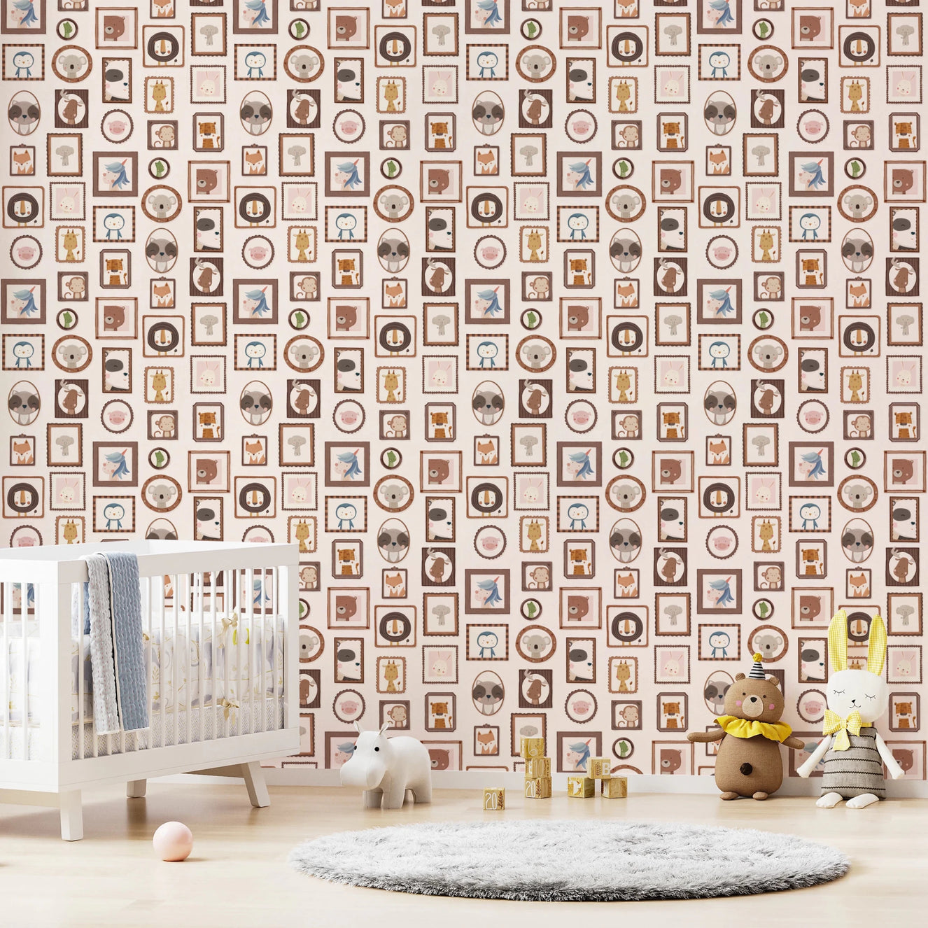 Nursery scene featuring Playful Animal Portraits Wallpaper behind crib and soft rug