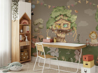 A friendly brown bear is sitting by a tree and waving.
