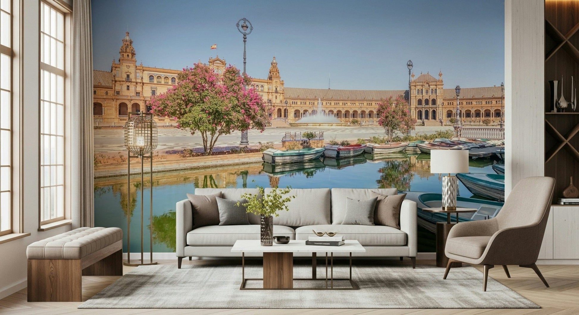 Plaza de España Charm Wall Mural gives this lounge a bright courtyard and canal backdrop