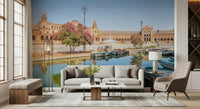 Plaza de España Charm Wall Mural gives this lounge a bright courtyard and canal backdrop