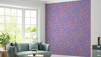 An installation view of the wallpaper being hung on a wall.

