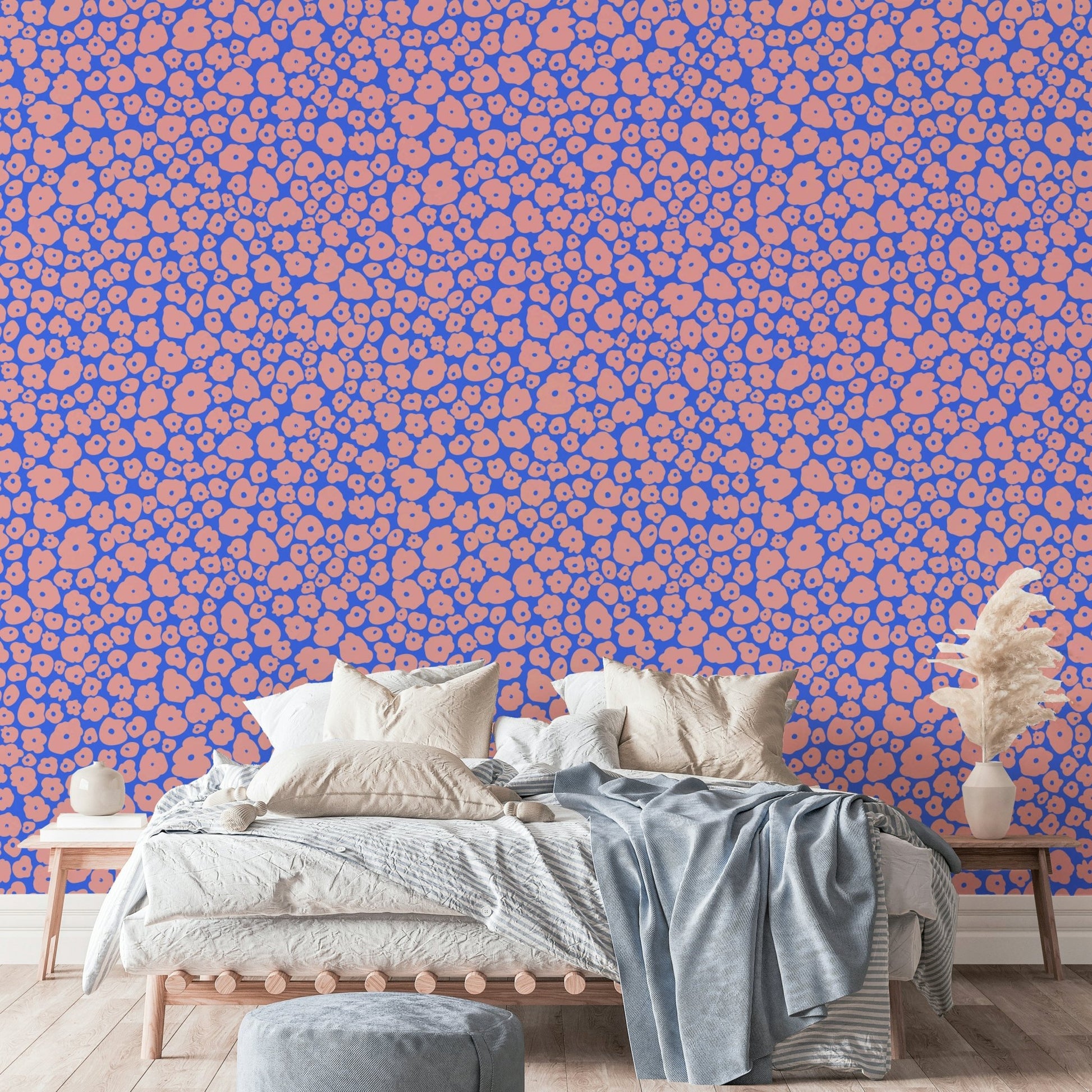A nursery wall covered in a puffy flowers wallpaper.

