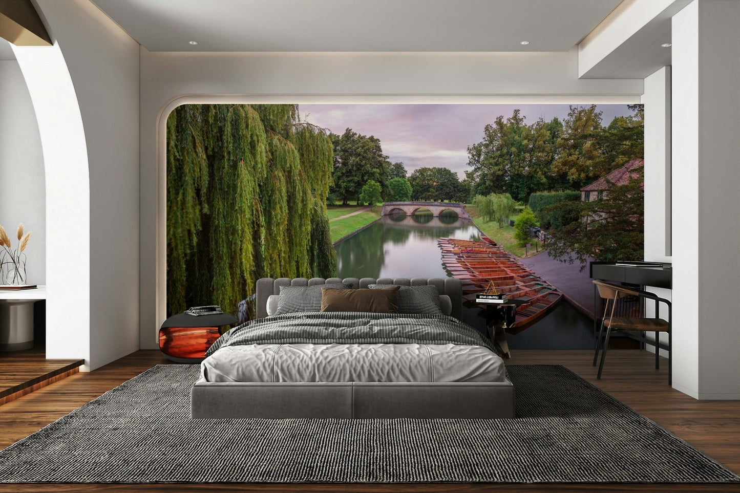 A long, flat-bottomed boat is visible on the water.

