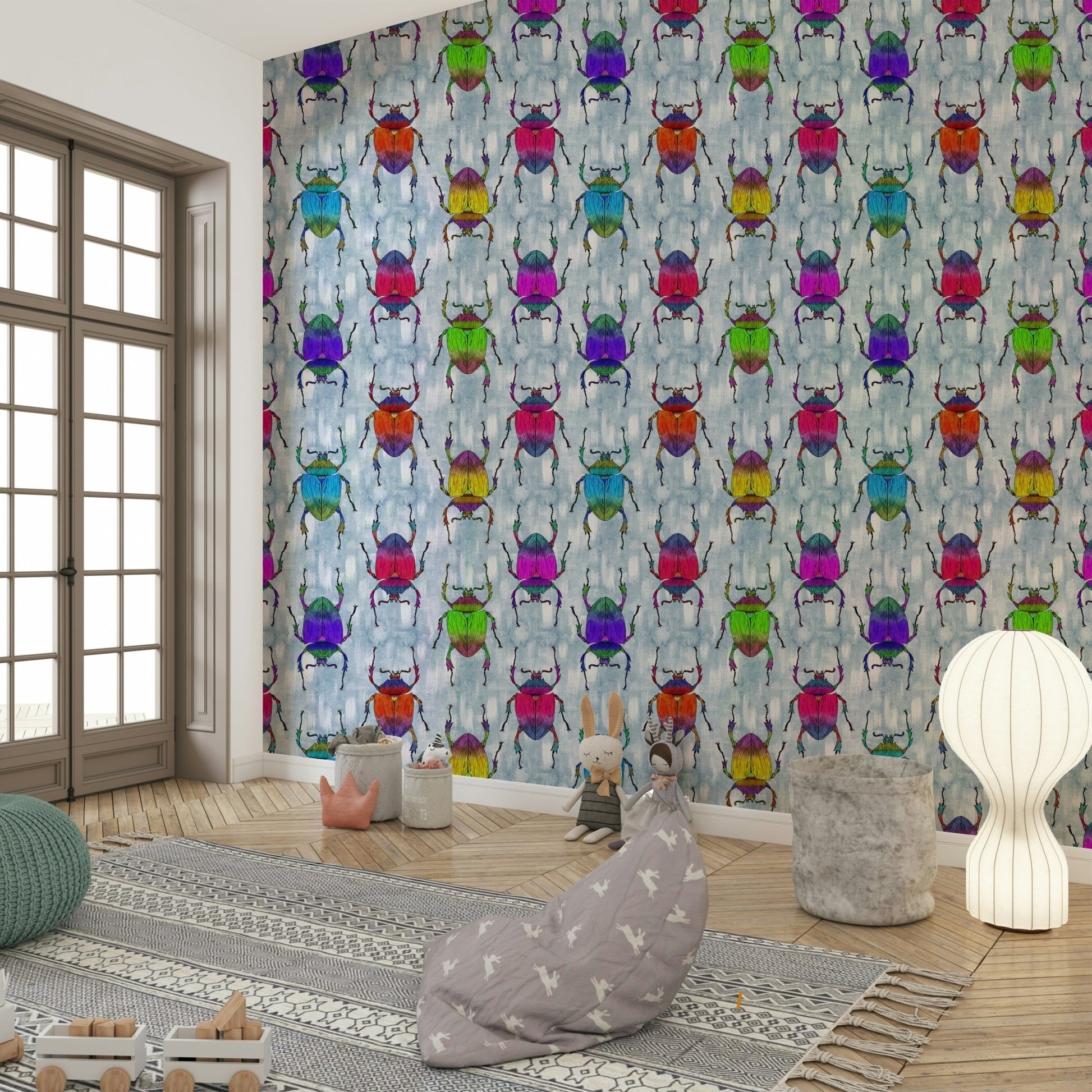 Kids’ room wallpaper with rainbow-toned bugs on cool blue.

