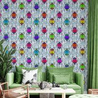 Rainbow beetles and butterflies on cheerful blue wallpaper.

