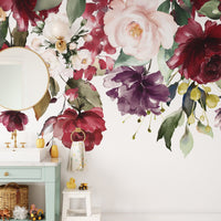 Bold floral mural wallpaper with red roses and greenery
