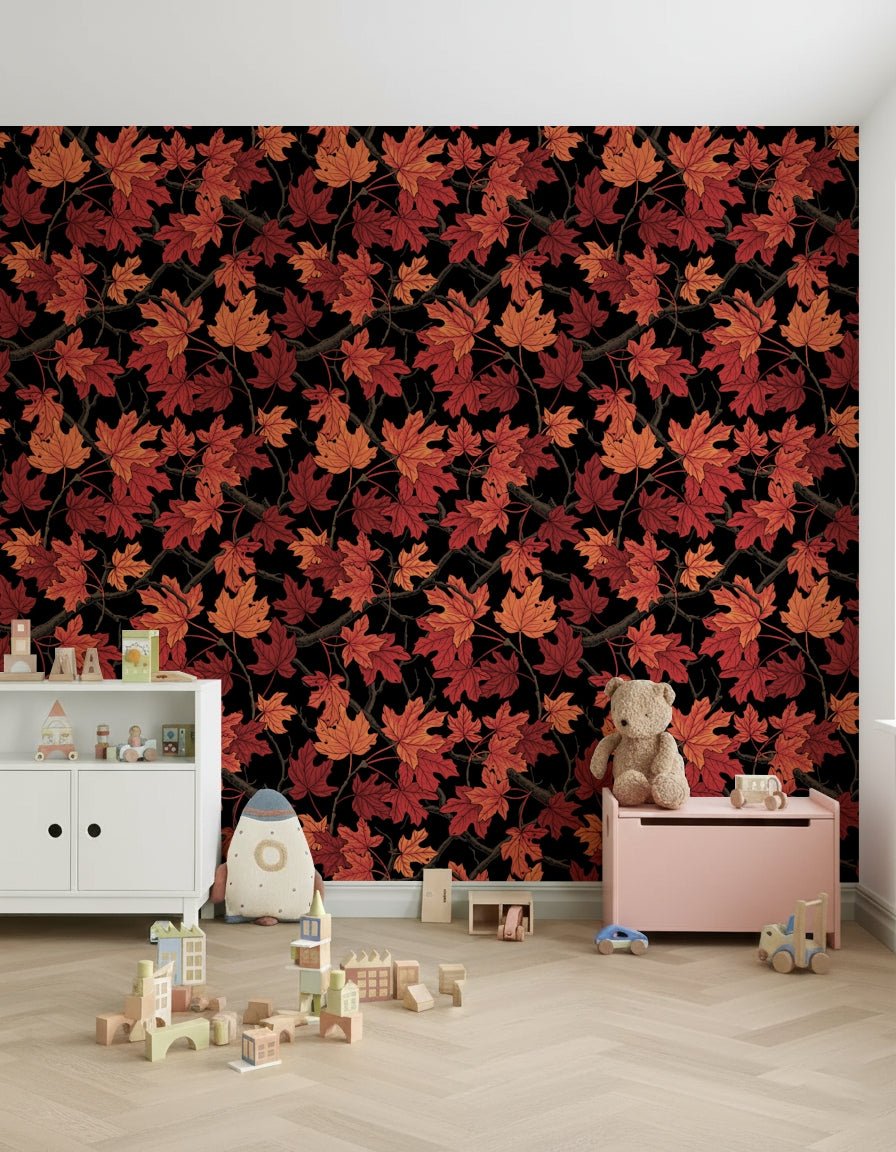 Red Autumn maple leaves on black Wallpaper accent wall behind a dark bed.