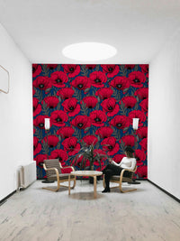 Dark blue wall with striking red poppy flower print

