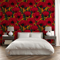 Red poppies pattern on vibrant orange wallpaper backdrop

